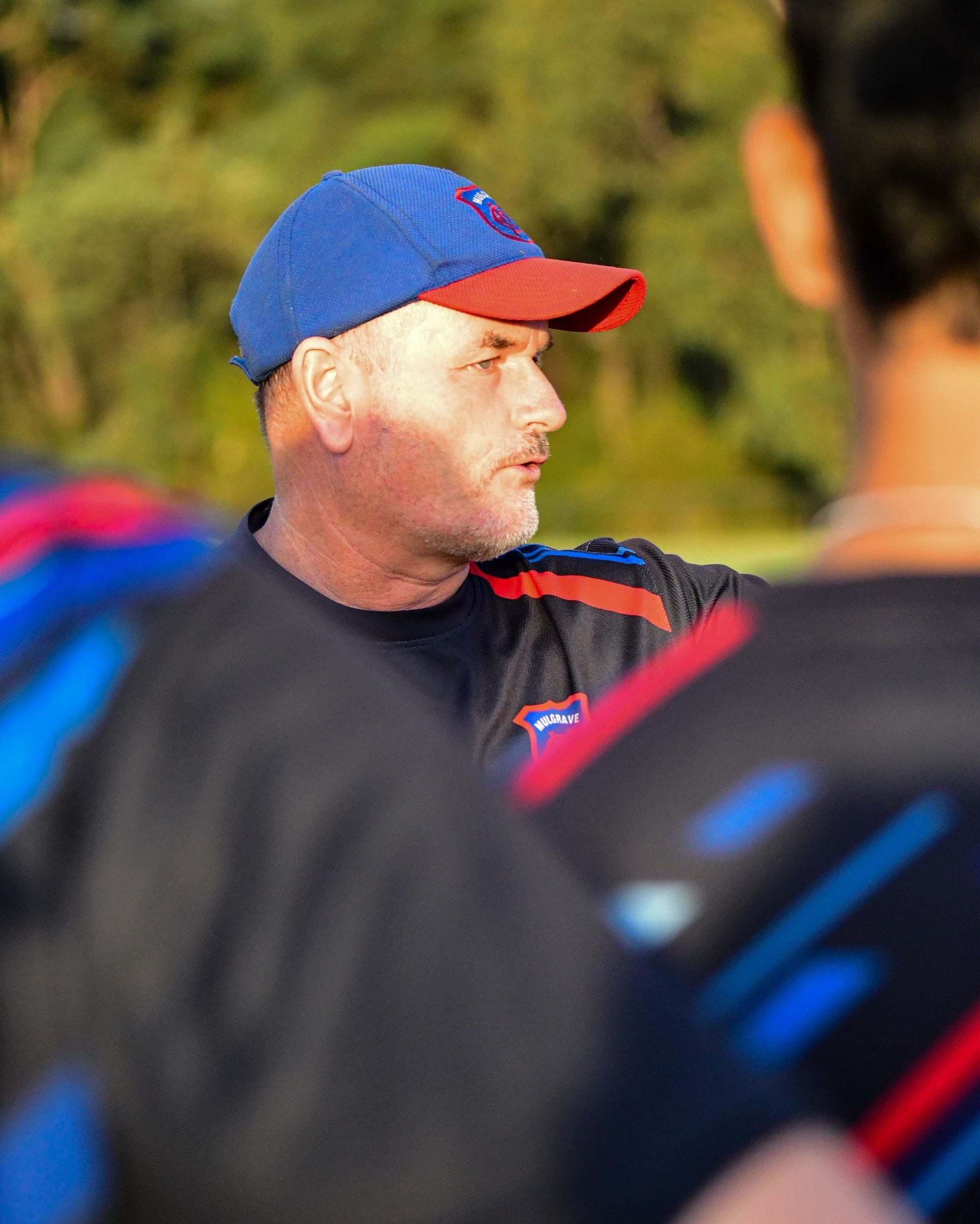 Coach Mick Hancock adresses the playing group.